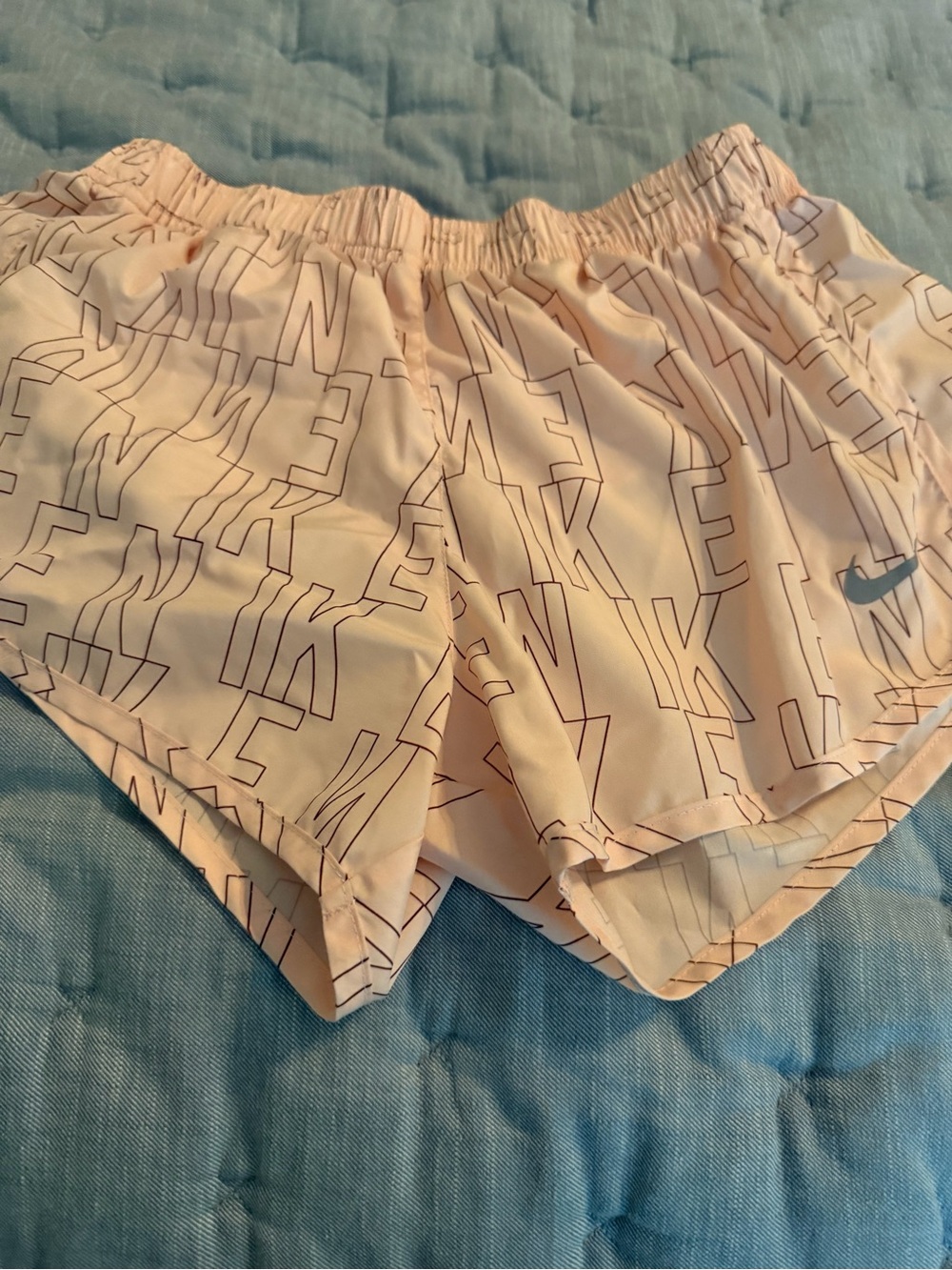 Nike Women's Light Pink All-Over Logo Athletic Shorts
